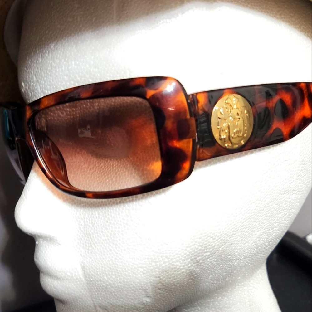 J Lo by Jennifer Lopez tortoise shell sunglasses.